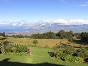 Upcountry vista with the west Maui mountains shrouded in clouds.