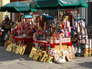 Street vender hocking Jesus related items.  Does Jesus' estate receive any royalties?  