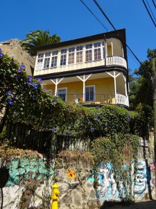 House on a cliff.  Note the graffiti at the bottom.