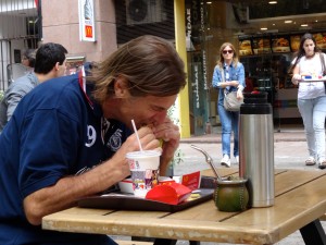 This guy is taking some time away from his mate' (seen just in front of him) to enjoy a Big Mac. 