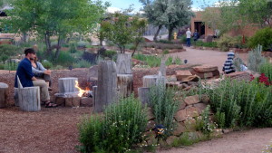 Fire pit being enjoyed by 2 guests.