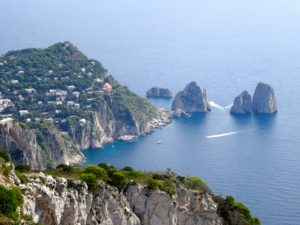 Boats seem to be cavorting arounds these rock outcroppings.